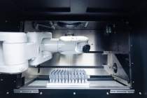 AMCM M 290 Kilowatt-System with the robot arm for multi-material applications as well as sensoring of parts