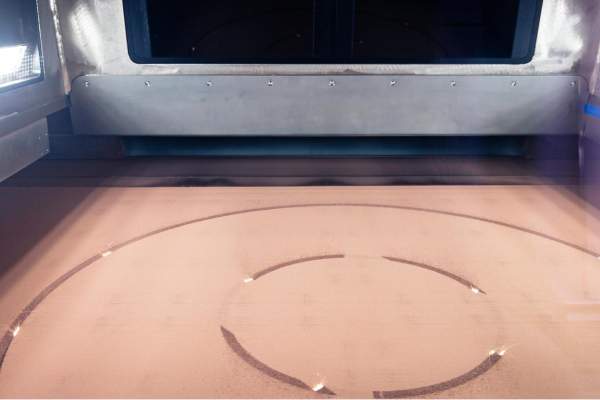 AMCM M 8K build chamber with copper powder and 8 lasers in action