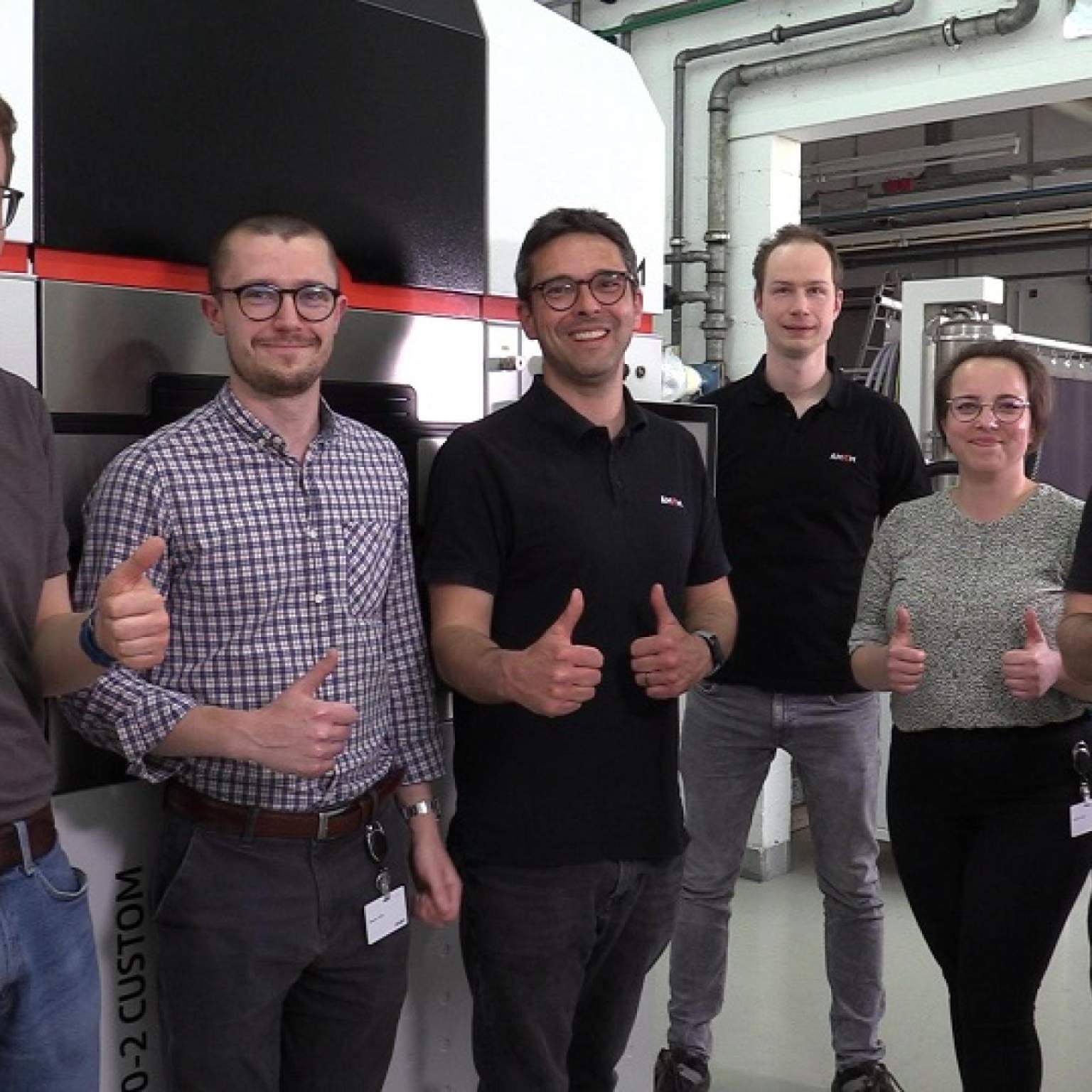AMCM–MTC Team in Front of the AMCM M 290 with nLIGHT Technology