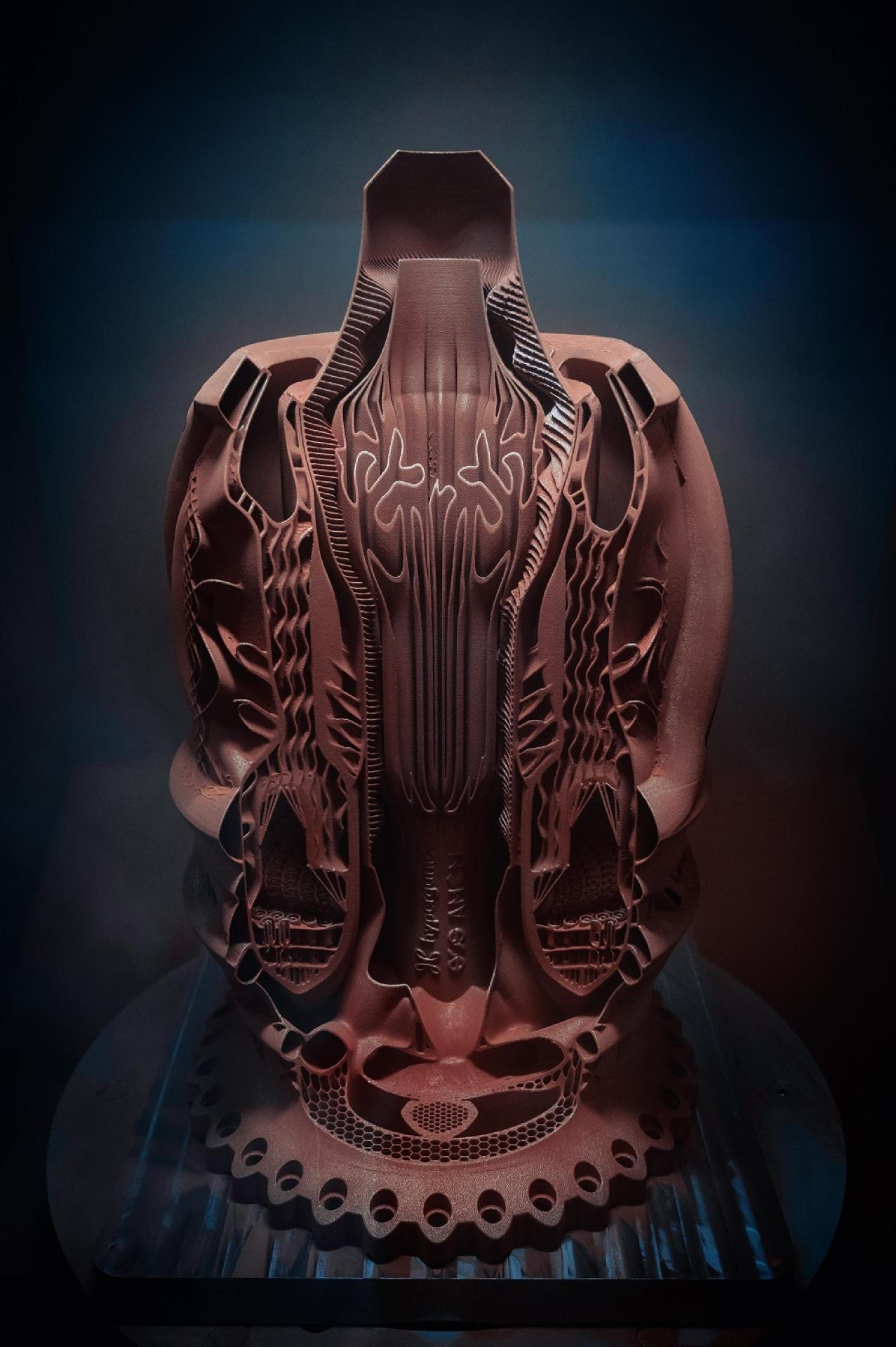 Copper alloy combustion chamber as a demonstrator (not for real use), printed on an AMCM M 4K system with a size of approx. 800 mm using Hyperganic Group's advanced software algorithms, without a single piece of CAD by hand.