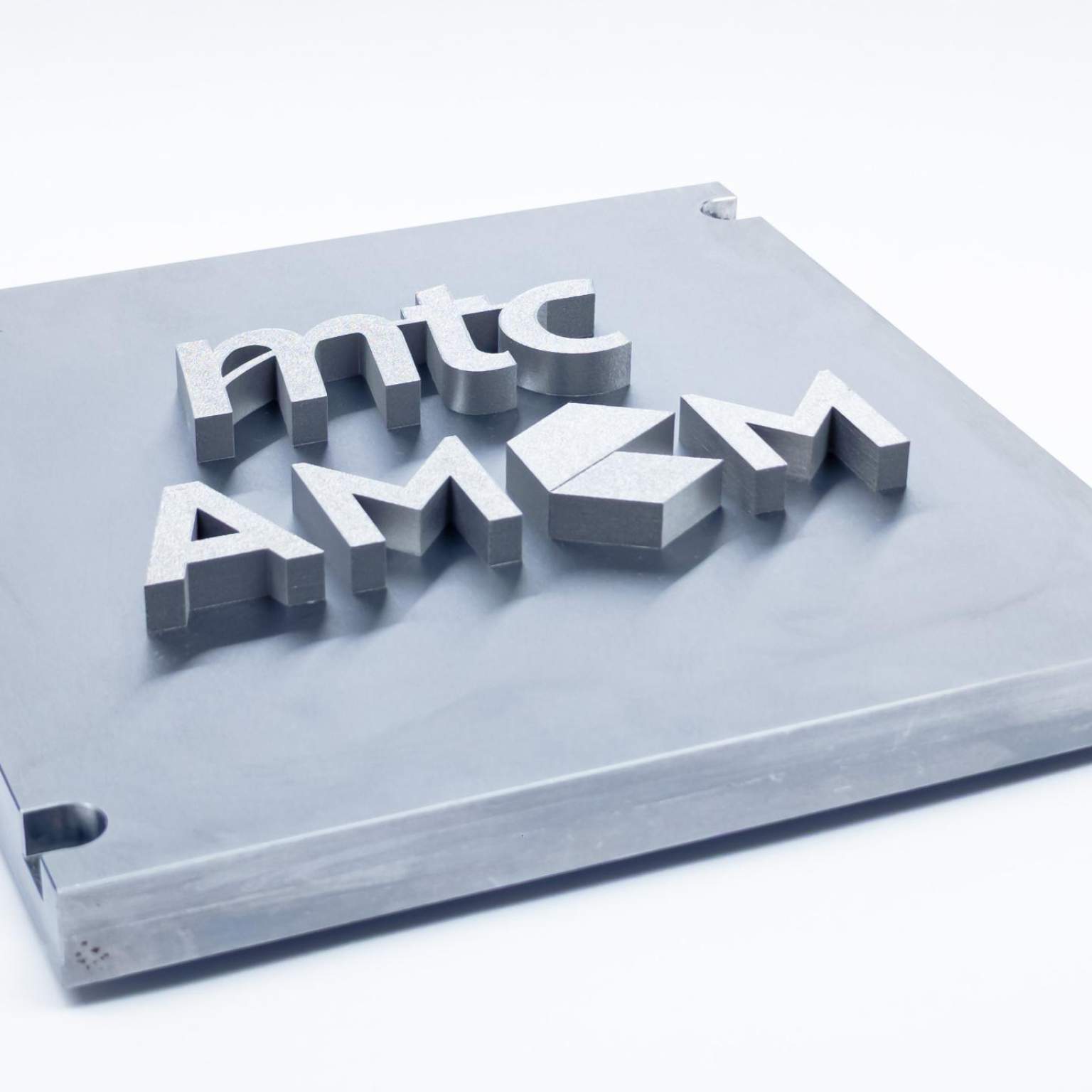 Section of a component manufactured using beam forming technology, the mtc and AMCM logos are printed in relief