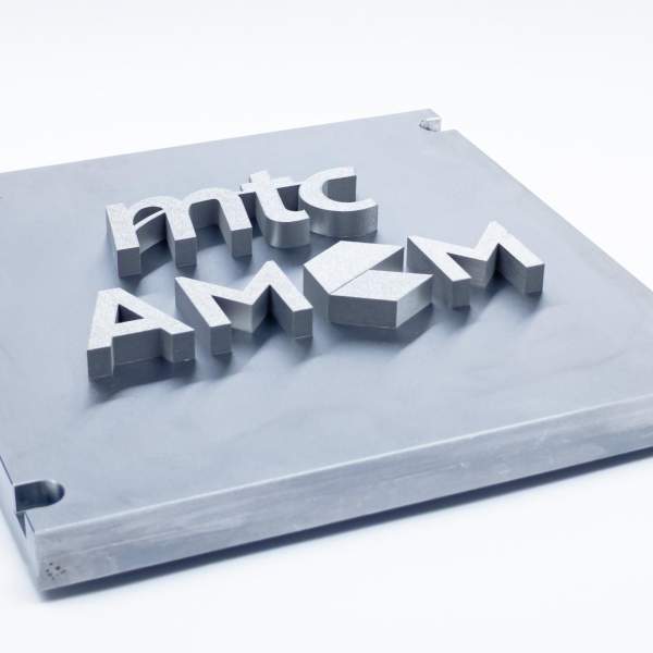 Section of a component manufactured using beam forming technology, the mtc and AMCM logos are printed in relief