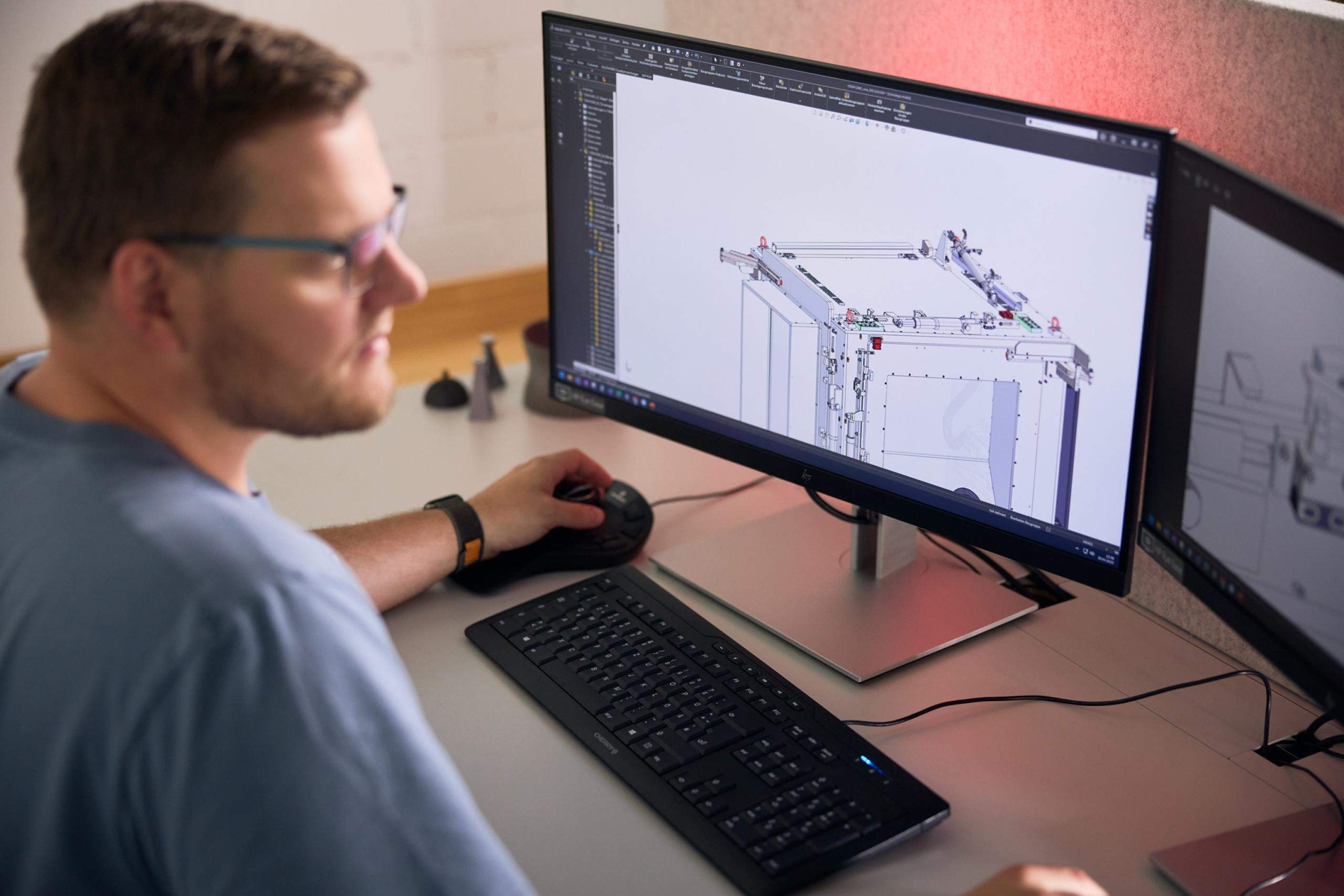 System Developer Working at Computer Screen